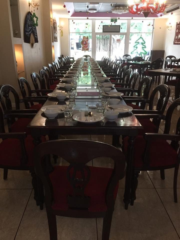 A long table set for a large group in the dining room